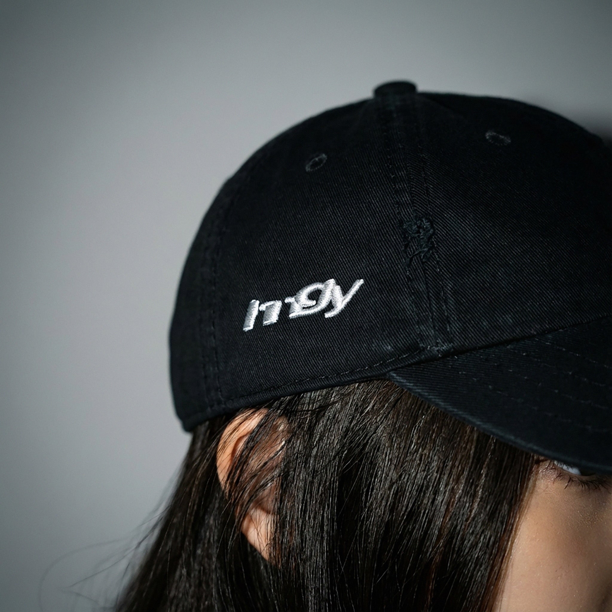 Close-up of the embroidered HNGY logo on the Black Cap.